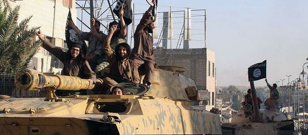 This undated image posted by the Raqqa Media Center, a Syrian opposition group, on Monday, June 30, 2014, which has been verified and is consistent with other AP reporting, shows fighters from the al-Qaida linked Islamic State of Iraq and the Levant (ISIL) during a parade in Raqqa, Syria. - Sputnik International