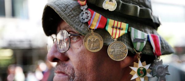 Vietnam veteran Laurence Lynch of Mount Vernon, NY, wears his medals on his hat as he marches with other Vietnam veterans during the annual Veterans Day parade in New York, Tuesday, Nov. 11, 2014 Vietnam veteran Laurence Lynch of Mount Vernon, NY, wears his medals on his hat as he marches with other Vietnam veterans during the annual Veterans Day parade in New York, Tuesday, Nov. 11, 2014 - Sputnik International