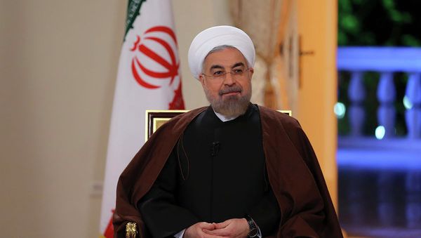 In this photo released by the Iranian Presidency Office, President Hassan Rouhani attends an interview with the state-run TV in Tehran, Iran, on Monday, Oct. 13, 2014 In this photo released by the Iranian Presidency Office, President Hassan Rouhani attends an interview with the state-run TV in Tehran, Iran, on Monday, Oct. 13, 2014 - Sputnik International