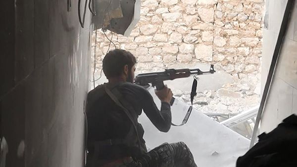 This undated photo posted on Monday, Nov. 4, 2014 by the Raqqa Media Office of the Islamic State group, a militant extremist group, shows an Islamic state group fighter in Kobani, Syria - Sputnik International