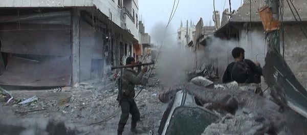 This undated file photo posted on Monday, Nov. 4, 2014 by the Raqqa Media Office of the Islamic State group, a militant extremist group, shows fighting in Kobani, Syria This undated file photo posted on Monday, Nov. 4, 2014 by the Raqqa Media Office of the Islamic State group, a militant extremist group, shows fighting in Kobani, Syria - Sputnik International