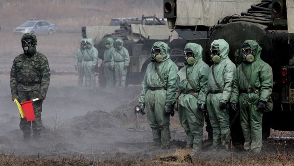 Servicemen of a radioactive and chemical protection unit during an inter-agency training exercise Servicemen of a radioactive and chemical protection unit during an inter-agency training exercise - Sputnik International