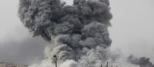 Thick smoke rises following an airstrike by the US-led coalition in Kobani, Syria as fighting intensified between Syrian Kurds and the militants of Islamic State group, as seen from Mursitpinar in the outskirts of Suruc, at the Turkey-Syria border, Sunday, Oct. 12, 2014. Thick smoke rises following an airstrike by the US-led coalition in Kobani, Syria as fighting intensified between Syrian Kurds and the militants of Islamic State group, as seen from Mursitpinar in the outskirts of Suruc, at the Turkey-Syria border, Sunday, Oct. 12, 2014. - Sputnik International