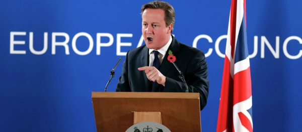 British Prime Minister David Cameron speaks during a media conference after an EU summit at the EU Council building in Brussels, on Friday, Oct. 24, 2014 - Sputnik International