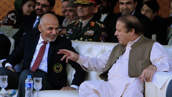 Afghan President Ashraf Ghani (L) talks with Pakistani Prime Minister Nawaz Sharif while watching a cricket match between their countries, in Islamabad November 15, 2014. Afghan President Ashraf Ghani (L) talks with Pakistani Prime Minister Nawaz Sharif while watching a cricket match between their countries, in Islamabad November 15, 2014. - Sputnik International