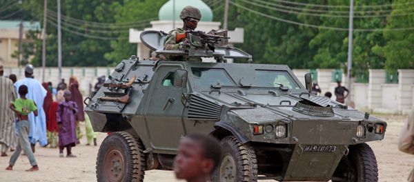 A Nigerian soldier patrols in an armored car, during Eid al-Fitr celebrations, in Maiduguri, Nigeria. A Nigerian soldier patrols in an armored car, during Eid al-Fitr celebrations, in Maiduguri, Nigeria. - Sputnik International