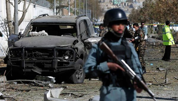 Afghan security forces inspect the site of a suicide attack in Kabul Afghan security forces inspect the site of a suicide attack in Kabul - Sputnik International