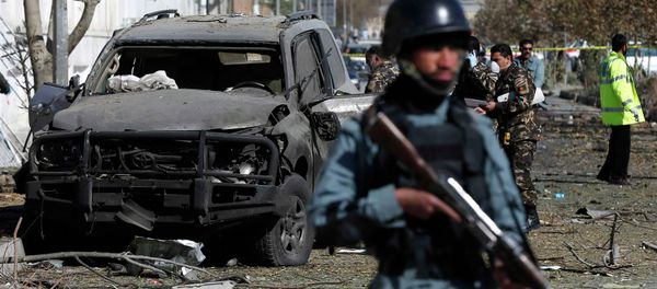 Afghan security forces inspect the site of a suicide attack in Kabul - Sputnik International