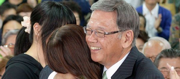 Former mayor of Naha, the capital city of Okinawa prefecture, Takeshi Onaga, (R) hugs his daughter as they celebrate his victory in the Okinawa gubernatorial election in Naha on the Japanese southern islands of Okinawa Former mayor of Naha, the capital city of Okinawa prefecture, Takeshi Onaga, (R) hugs his daughter as they celebrate his victory in the Okinawa gubernatorial election in Naha on the Japanese southern islands of Okinawa - Sputnik International