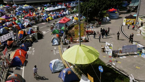 An installation in the shape of a yellow umbrella, a symbol of the Occupy Central civil disobedience movement, is seen at their Admiralty protest site in Hong Kong November 17, 2014. - Sputnik International