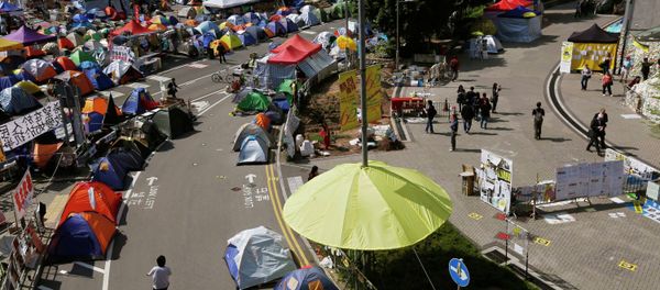An installation in the shape of a yellow umbrella, a symbol of the Occupy Central civil disobedience movement, is seen at their Admiralty protest site in Hong Kong November 17, 2014. An installation in the shape of a yellow umbrella, a symbol of the Occupy Central civil disobedience movement, is seen at their Admiralty protest site in Hong Kong November 17, 2014. - Sputnik International