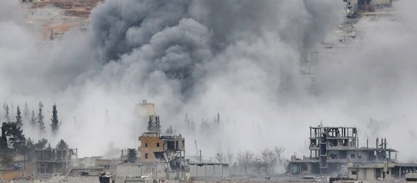 Smoke rises from the Syrian city of Kobani Smoke rises from the Syrian city of Kobani - Sputnik International