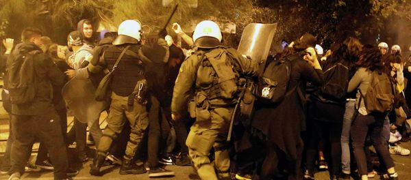 Riot policemen clash with protesters at a rally marking the 41st anniversary of a 1973 student uprising against a US backed military dictatorship in Greece. Riot policemen clash with protesters at a rally marking the 41st anniversary of a 1973 student uprising against a US backed military dictatorship in Greece. - Sputnik International