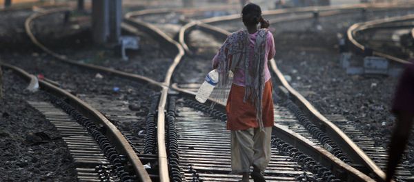 An Indian woman walks after defecating on a railway track, on World Toilet Day in Gauhati, India, Wednesday, Nov. 19 2014 An Indian woman walks after defecating on a railway track, on World Toilet Day in Gauhati, India, Wednesday, Nov. 19 2014 - Sputnik International