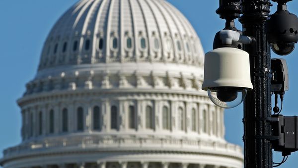 Surveillance cameras are visible near the U.S.Capitol in Washington Saturday, Oct. 26, 2013 - Sputnik International
