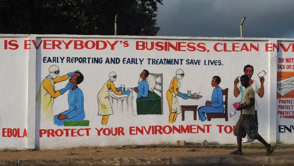 A man walks by a mural with health instructions on treating the Ebola virus, in Monrovia, November 18, 2014 A man walks by a mural with health instructions on treating the Ebola virus, in Monrovia, November 18, 2014 - Sputnik International
