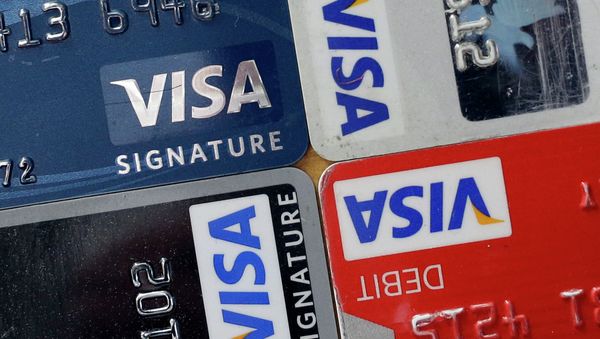 In this April 25, 2013 file photo, credit and debit cards are displayed for a photographer in Baltimore. Visa Inc. reports quarterly earnings on Thursday, April 24, 2014 - Sputnik International