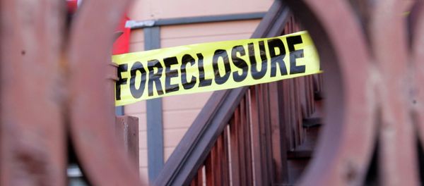 Foreclosure sign shown through a front gate of a foreclosed home in Oakland, California Foreclosure sign shown through a front gate of a foreclosed home in Oakland, California - Sputnik International
