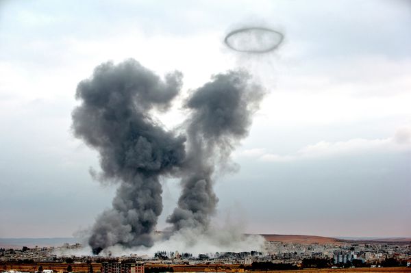 Smoke rises from the Syrian city of Kobani, following airstrikes by the US led coalition, seen from a hilltop outside Suruc, on the Turkey-Syria border Monday, Nov. 17, 2014 Smoke rises from the Syrian city of Kobani, following airstrikes by the US led coalition, seen from a hilltop outside Suruc, on the Turkey-Syria border Monday, Nov. 17, 2014 - Sputnik International