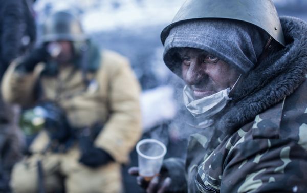 An opposition supporter drinks tea on Grushevskiy street in Kiev. An opposition supporter drinks tea on Grushevskiy street in Kiev. - Sputnik International