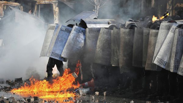 Police officers during the clashes. Police officers during the clashes. - Sputnik International