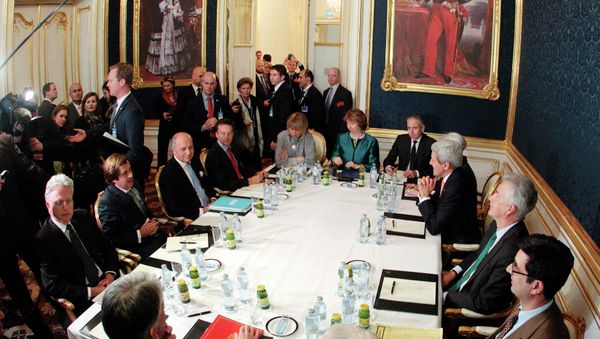 French Foreign Minister Laurent Fabius (3rd L), EU envoy Catherine Ashton (6th L), U.S. Secretary of State John Kerry (3rd R) and Britain's Foreign Secretary Philip Hammond (front L) sit a a table during talks in Vienna November 21, 2014 French Foreign Minister Laurent Fabius (3rd L), EU envoy Catherine Ashton (6th L), U.S. Secretary of State John Kerry (3rd R) and Britain's Foreign Secretary Philip Hammond (front L) sit a a table during talks in Vienna November 21, 2014 - Sputnik International