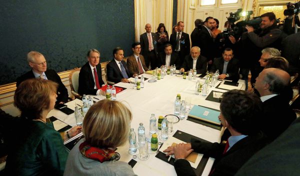 Former EU foreign policy chief Catherine Ashton, left, British Foreign Secretary Philip Hammond, third left, Iranian Foreign Minister Mohammad Javad Zarif, rear center, and French Foreign Minister Laurent Fabius, second right, wait for the start of closed-door nuclear talks with Iran. Former EU foreign policy chief Catherine Ashton, left, British Foreign Secretary Philip Hammond, third left, Iranian Foreign Minister Mohammad Javad Zarif, rear center, and French Foreign Minister Laurent Fabius, second right, wait for the start of closed-door nuclear talks with Iran. - Sputnik International