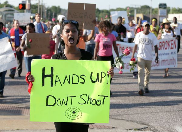 Protesters march Tuesday for Michael Brown, who was killed by police in Ferguson - Sputnik International