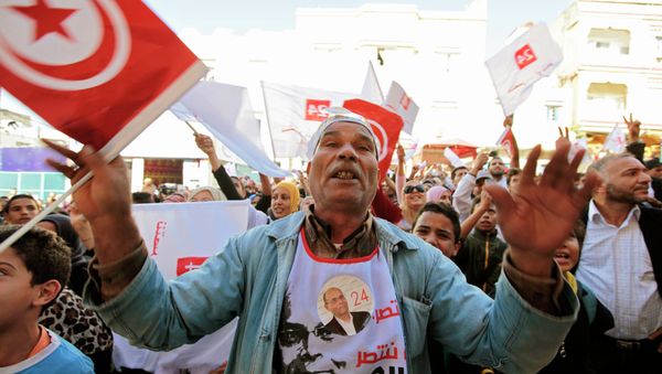 Tunisia should drop criminal proceedings against a police union leader, sentenced to two years in prison in November on charges of defaming the army, following an in-absentia trial of which he was not notified - Sputnik International