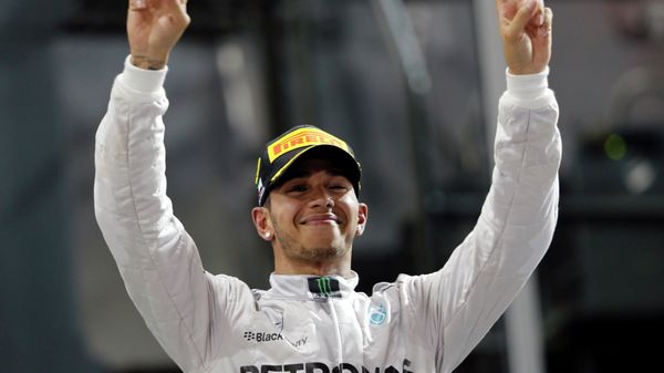 Mercedes Formula One driver Lewis Hamilton of Britain celebrates on the podium after winning the Abu Dhabi F1 Grand Prix at the Yas Marina circuit in Abu Dhabi - Sputnik International