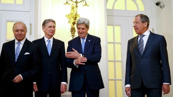 French Foreign Minister Laurent Fabius, Britain's Foreign Secretary Philip Hammond, U.S. Secretary of State John Kerry and Russian Foreign Minister Sergei Lavrov (LtoR) pose for photographers before a meeting in Vienna French Foreign Minister Laurent Fabius, Britain's Foreign Secretary Philip Hammond, U.S. Secretary of State John Kerry and Russian Foreign Minister Sergei Lavrov (LtoR) pose for photographers before a meeting in Vienna - Sputnik International