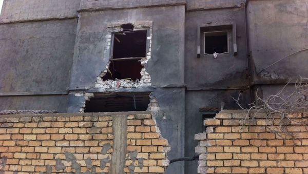 A building damaged by an airstrike near Mitiga airport in Libya's capital Tripoli, November 25, 2014. A building damaged by an airstrike near Mitiga airport in Libya's capital Tripoli, November 25, 2014. - Sputnik International