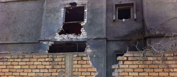 A building damaged by an airstrike near Mitiga airport in Libya's capital Tripoli, November 25, 2014. A building damaged by an airstrike near Mitiga airport in Libya's capital Tripoli, November 25, 2014. - Sputnik International