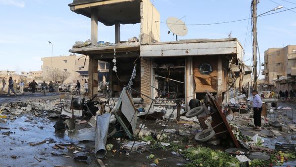 A site hit by what activists said were airstrikes by forces loyal to Syria's President Bashar al-Assad is pictured in Raqqa, eastern Syria, which is controlled by the Islamic State November 25, 2014 A site hit by what activists said were airstrikes by forces loyal to Syria's President Bashar al-Assad is pictured in Raqqa, eastern Syria, which is controlled by the Islamic State November 25, 2014 - Sputnik International