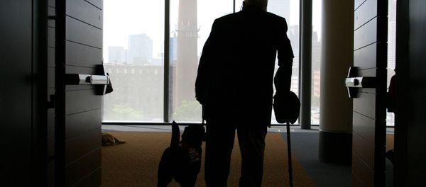 Wilson Hulley of Chevy Chase, Md., and his service dog Laurel leave at the end of the New England Assistance Dog Services (NEADS) graduation for dogs who assist the deaf and disabled at the Boston Convention and Exhibition Center Wilson Hulley of Chevy Chase, Md., and his service dog Laurel leave at the end of the New England Assistance Dog Services (NEADS) graduation for dogs who assist the deaf and disabled at the Boston Convention and Exhibition Center - Sputnik International