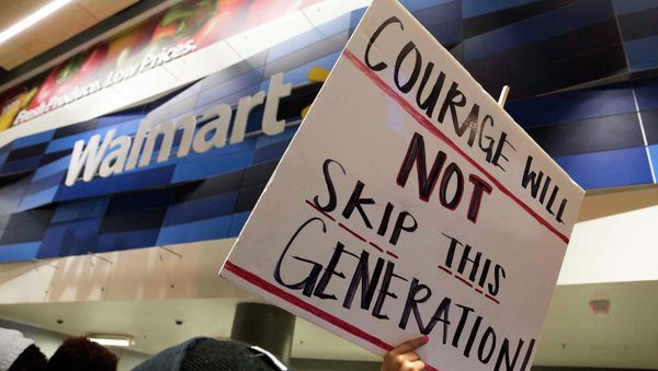 Demonstrators protest in a Walmart store located along the route of a Justice for Mike Brown march and rally after a grand jury failed to indict a white police officer in the shooting death of African-American teenager Michael Brown, in Washington November 25, 2014. - Sputnik International