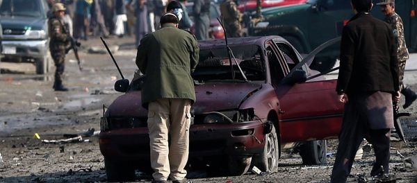 Afghan security forces inspect the site of a suicide attack on a British embassy vehicle in Kabul, November 27, 2014 Afghan security forces inspect the site of a suicide attack on a British embassy vehicle in Kabul, November 27, 2014 - Sputnik International