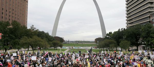 Protesters march past the St. Louis Arch, Saturday, Oct. 11, 2014, in St Louis Protesters march past the St. Louis Arch, Saturday, Oct. 11, 2014, in St Louis - Sputnik International