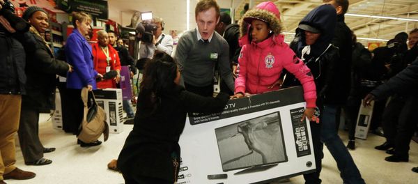 Shoppers wrestle over a television as they compete to purchase retail items on Black Friday at an Asda superstore in Wembley, north London November 28, 2014 Shoppers wrestle over a television as they compete to purchase retail items on Black Friday at an Asda superstore in Wembley, north London November 28, 2014 - Sputnik International