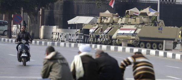 Armored vehicles stand alert at the entrance of Tahrir Square in Cairo, Egypt, Friday, Nov. 28, 2014 - Sputnik International