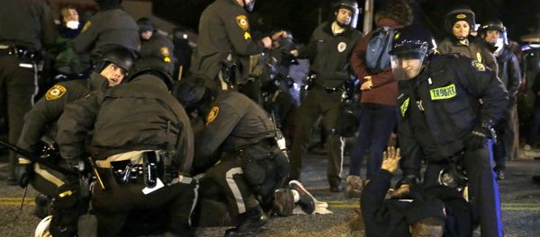 Protesters are taken into custody Friday, Nov. 28, 2014, in Ferguson, Mo. Protesters are taken into custody Friday, Nov. 28, 2014, in Ferguson, Mo. - Sputnik International