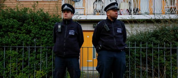 Police stand guard outside a South London Police stand guard outside a South London - Sputnik International