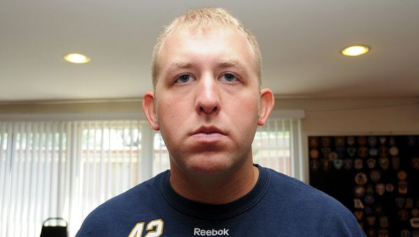 Officer Darren Wilson is pictured in this undated handout evidence photo from the August 9 Ferguson Police shooting of Michael Brown in Ferguson, Missouri, released by the St. Louis County Prosecutor's Office on November 24, 2014. Officer Darren Wilson is pictured in this undated handout evidence photo from the August 9 Ferguson Police shooting of Michael Brown in Ferguson, Missouri, released by the St. Louis County Prosecutor's Office on November 24, 2014. - Sputnik International