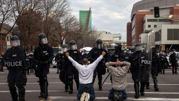 Protesters demanding justice for Michael Brown kneel on the ground before they are detained for disrupting traffic outside the Edward Jones Dome, the site of an NFL football game between the St. Louis Rams and the Oakland Raiders, in downtown St. Louis Protesters demanding justice for Michael Brown kneel on the ground before they are detained for disrupting traffic outside the Edward Jones Dome, the site of an NFL football game between the St. Louis Rams and the Oakland Raiders, in downtown St. Louis - Sputnik International