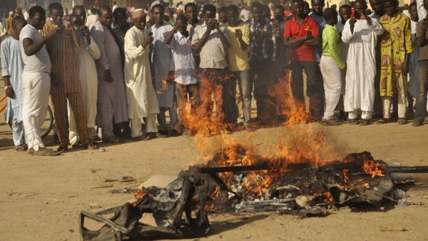 People gather at the site of a bomb explosion in Kano, Nigeria People gather at the site of a bomb explosion in Kano, Nigeria - Sputnik International