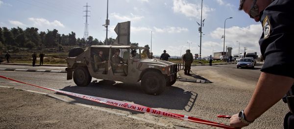 Israeli soldiers and police officers stand at the scene of a stabbing attack at the West Bank Gush Etzion junction near Jerusalem Israeli soldiers and police officers stand at the scene of a stabbing attack at the West Bank Gush Etzion junction near Jerusalem - Sputnik International