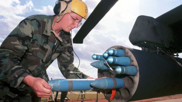 In this undated handout photo released by General Dynamics, a technician loads Hydra-70 rockets - Sputnik International