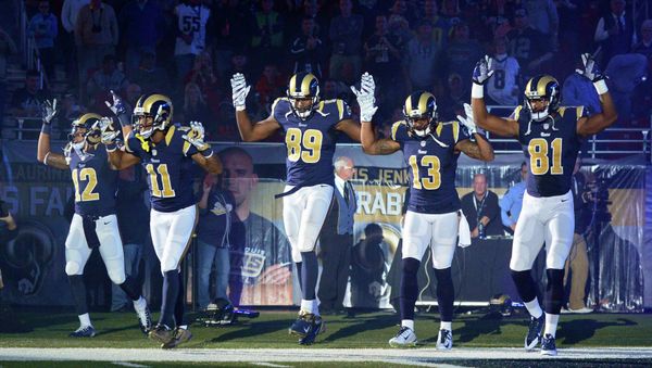 St. Louis Rams wide receiver Stedman Bailey (12), wide receiver Tavon Austin (11), tight end Jared Cook (89), wide receiver Chris Givens (13) and wide receiver Kenny Britt (81) put their hands up to show support for Michael Brown before a game against the Oakland Raiders at the Edward Jones Dome in St Louis November 30, 2014. St. Louis Rams wide receiver Stedman Bailey (12), wide receiver Tavon Austin (11), tight end Jared Cook (89), wide receiver Chris Givens (13) and wide receiver Kenny Britt (81) put their hands up to show support for Michael Brown before a game against the Oakland Raiders at the Edward Jones Dome in St Louis November 30, 2014. - Sputnik International