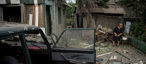 Luhansk resident near her house destoyed as result of the shelling by Ukraine's armed forces. Luhansk resident near her house destoyed as result of the shelling by Ukraine's armed forces. - Sputnik International