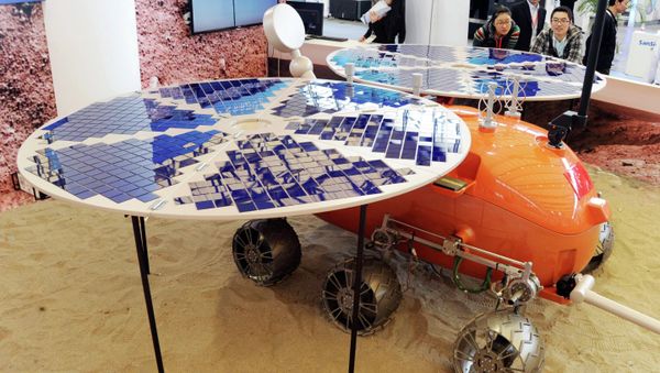 Visitors look at a prototype model of a Mars rover, which was designed and built in China, on display at the China International Industry Fair in Shanghai Visitors look at a prototype model of a Mars rover, which was designed and built in China, on display at the China International Industry Fair in Shanghai - Sputnik International